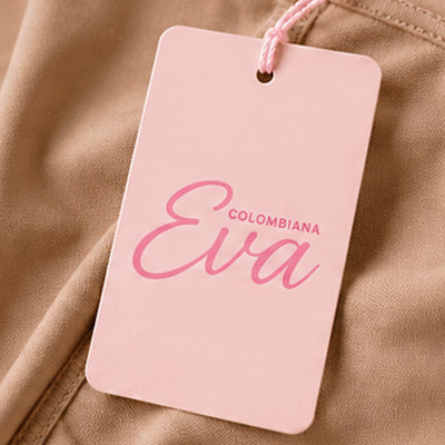 A light pink rectangular product tag with rounded corners, attached by a matching pink string. The tag has the brand name 'COLOMBIANA' in small uppercase letters above the larger script name 'Eva' in pink.