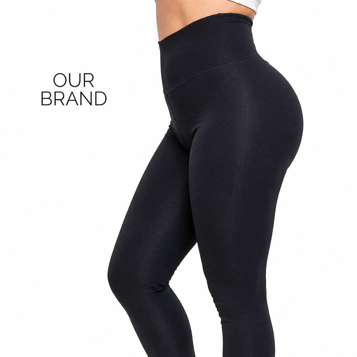 Black high-waisted leggings shown on a model from the waist down against a white background, with the text 'OUR BRAND' in the upper left.